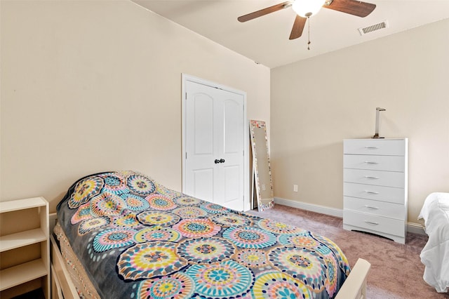 bedroom featuring light carpet and ceiling fan