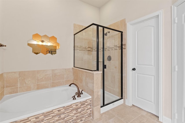 bathroom featuring tile patterned floors and shower with separate bathtub