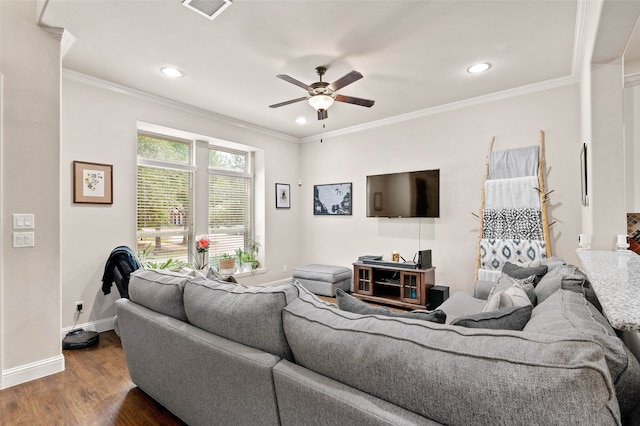 living room with dark hardwood / wood-style floors, ceiling fan, and crown molding