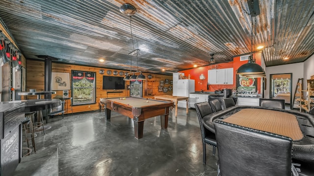 playroom with billiards and a wood stove