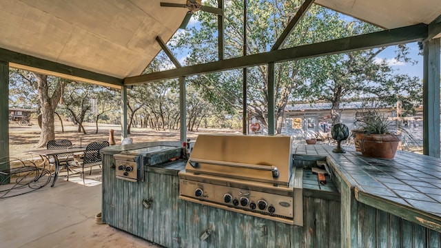 view of patio with an outdoor kitchen and grilling area