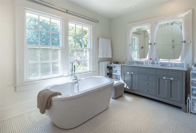 bathroom featuring vanity and a tub