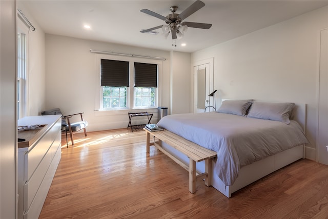 bedroom featuring light hardwood / wood-style floors and ceiling fan