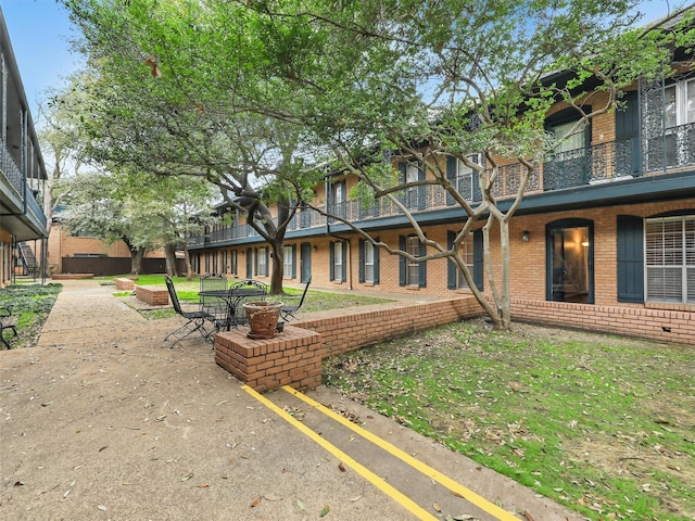 surrounding community featuring a patio