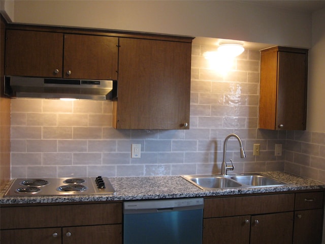 kitchen with dishwasher, backsplash, stainless steel gas stovetop, and sink