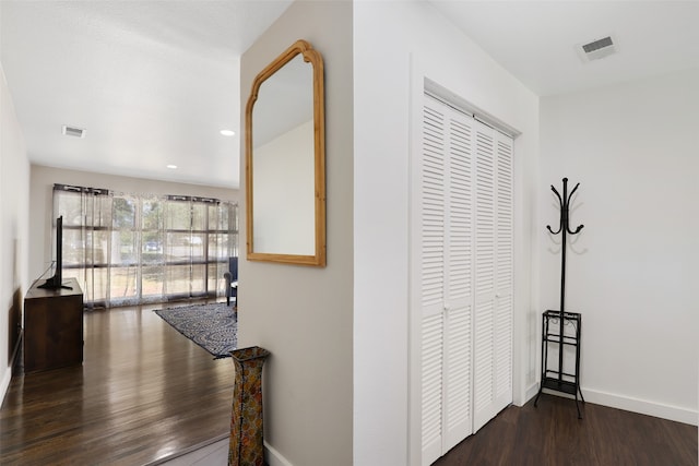 corridor with dark wood-type flooring