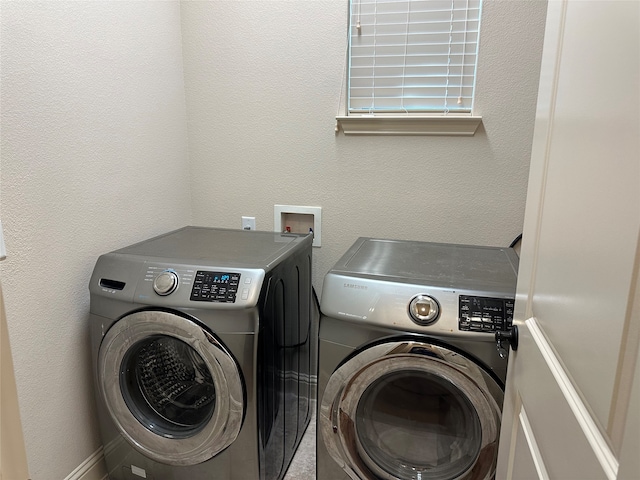 laundry room featuring separate washer and dryer