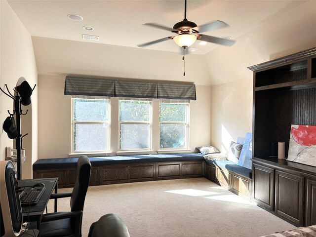 office area featuring carpet, lofted ceiling, a healthy amount of sunlight, and ceiling fan