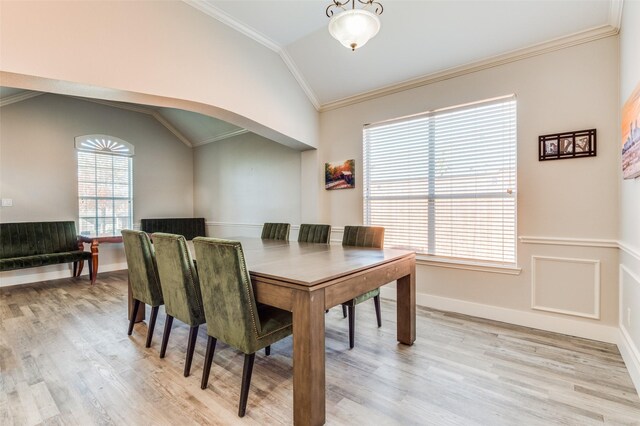 dining area featuring plenty of natural light, light hardwood / wood-style floors, and lofted ceiling