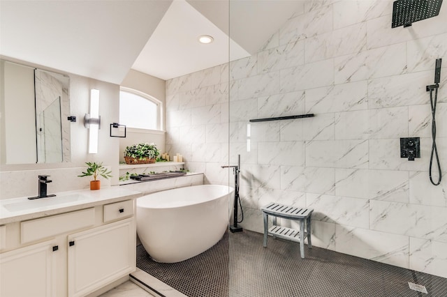 bathroom with separate shower and tub, tile patterned floors, vanity, and tile walls