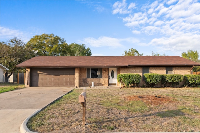 single story home with a front lawn and a garage