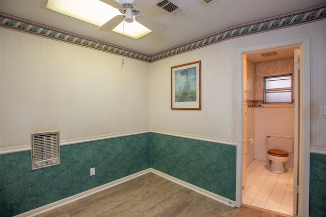 unfurnished room with wood-type flooring and ceiling fan