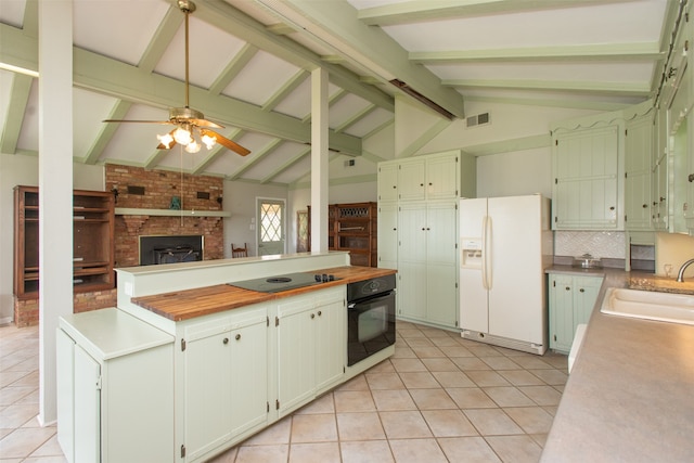 kitchen featuring ceiling fan, beam ceiling, sink, black appliances, and light tile patterned floors