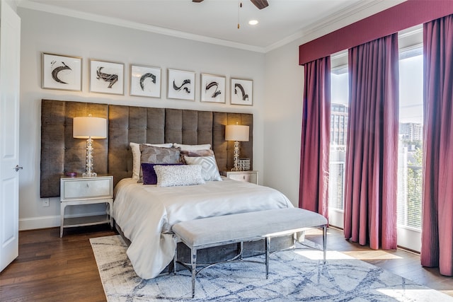 bedroom featuring crown molding, hardwood / wood-style flooring, and ceiling fan