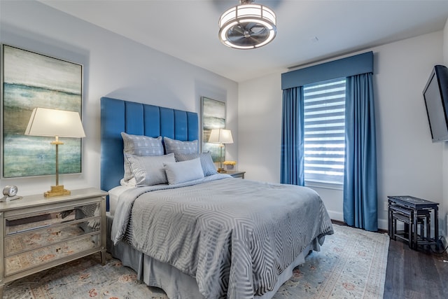 bedroom with hardwood / wood-style flooring