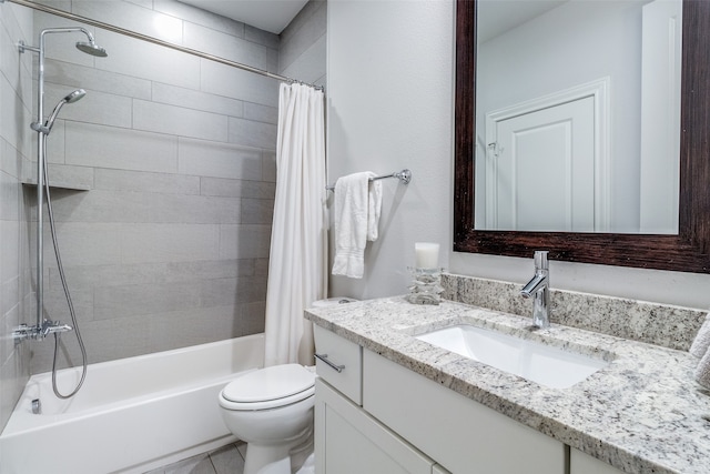 full bathroom featuring toilet, shower / bath combo with shower curtain, and vanity