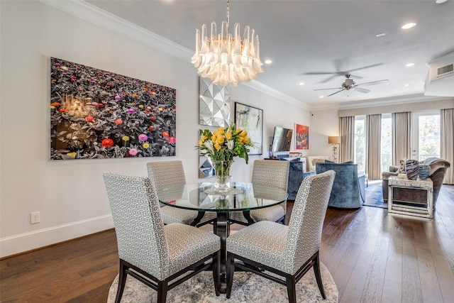 dining space with crown molding, dark hardwood / wood-style floors, and ceiling fan with notable chandelier