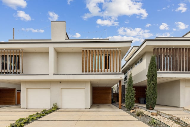 exterior space featuring a balcony and a garage