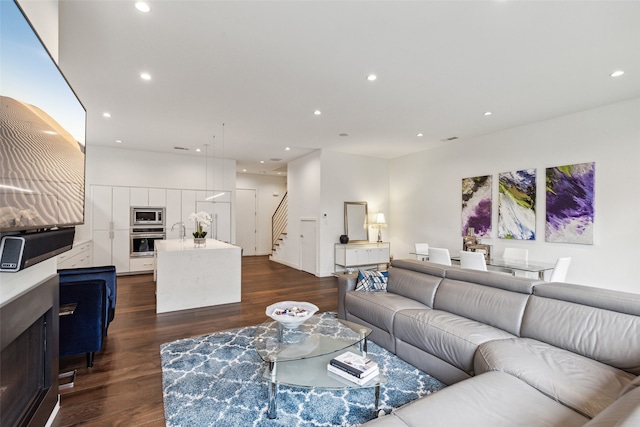 living room featuring dark wood-type flooring