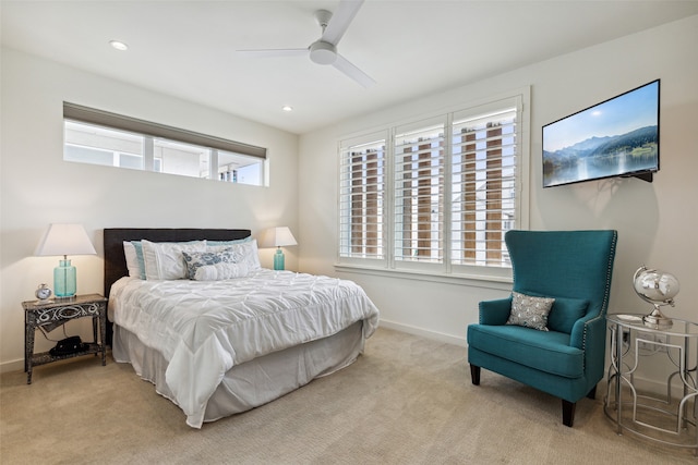 bedroom featuring light colored carpet and ceiling fan