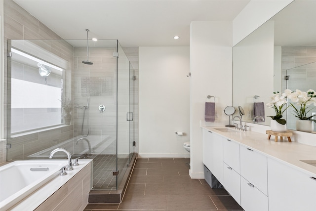 full bathroom featuring vanity, separate shower and tub, toilet, and tile patterned floors