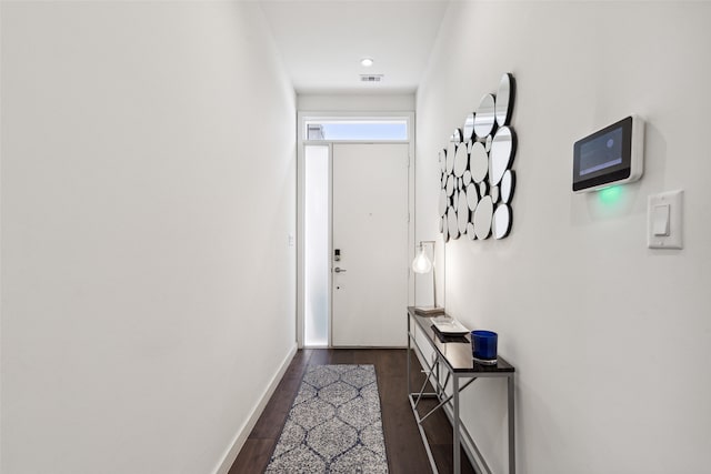 entryway with dark hardwood / wood-style floors