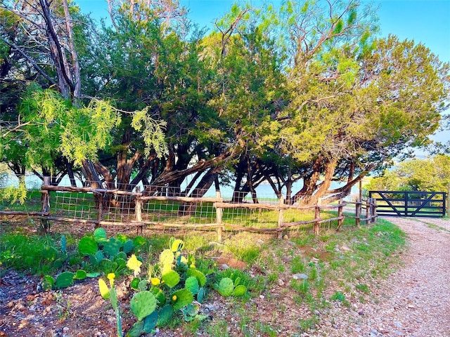 view of community with fence
