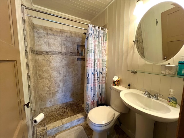 bathroom with walk in shower and toilet