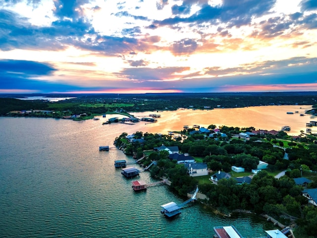 aerial view at dusk with a water view