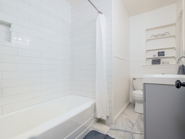 full bathroom with vanity, shower / tub combo, and toilet