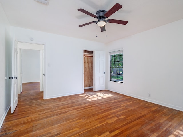 unfurnished bedroom featuring wood-type flooring and ceiling fan