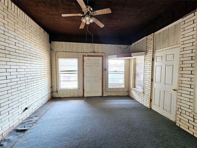 interior space with ceiling fan