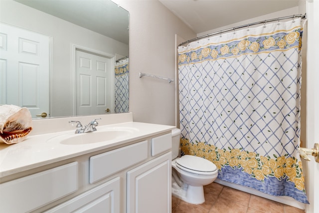 bathroom featuring a shower with curtain, tile patterned floors, vanity, and toilet