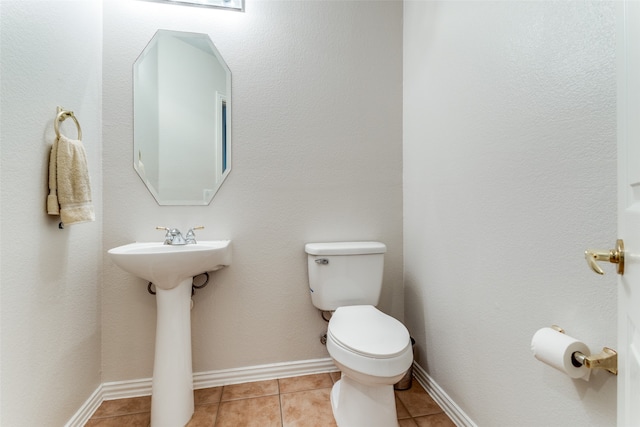 bathroom featuring tile patterned floors and toilet