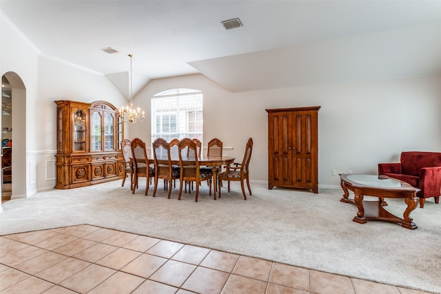 dining space featuring light colored carpet, an inviting chandelier, crown molding, and vaulted ceiling