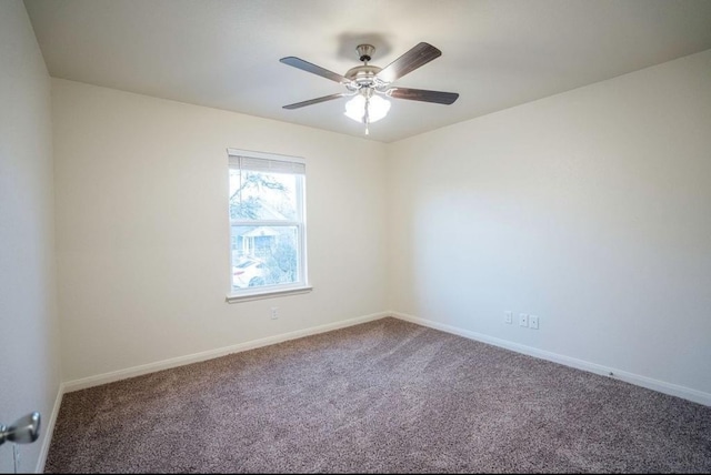 spare room featuring carpet floors and ceiling fan