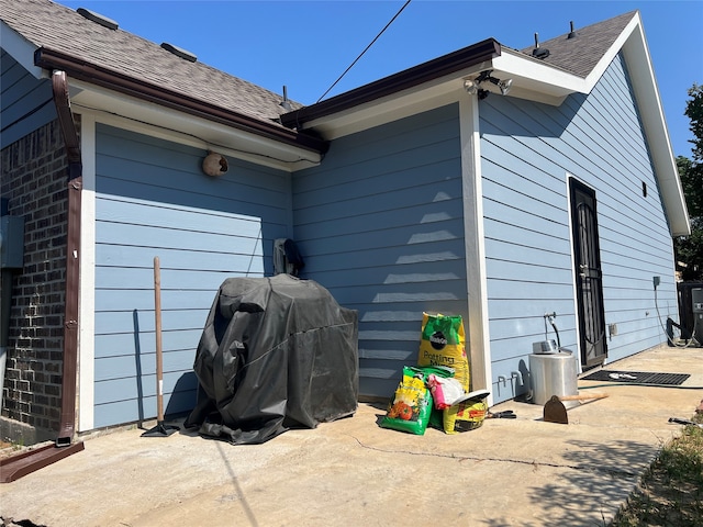 view of side of home with a patio area