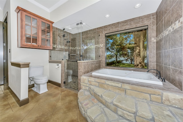 bathroom with tile patterned flooring, toilet, and shower with separate bathtub