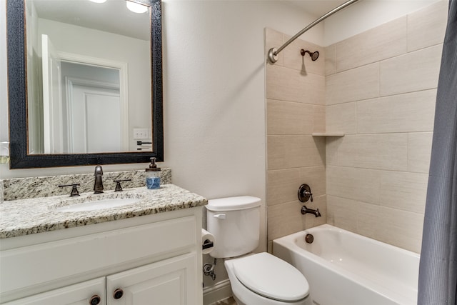 full bathroom with vanity, shower / bath combo, and toilet