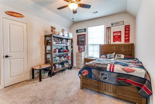 carpeted bedroom featuring ceiling fan and vaulted ceiling