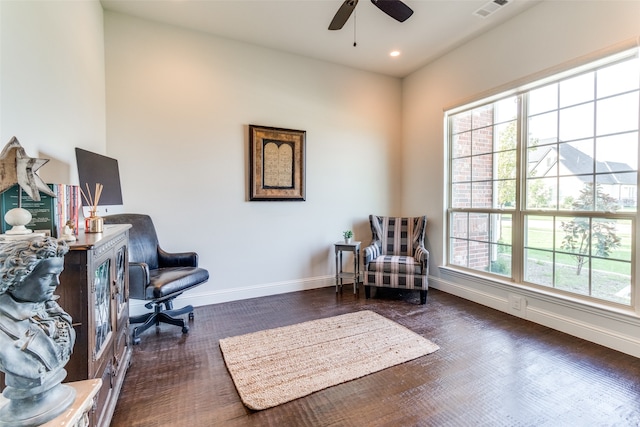 sitting room featuring dark hardwood / wood-style flooring, a healthy amount of sunlight, and ceiling fan