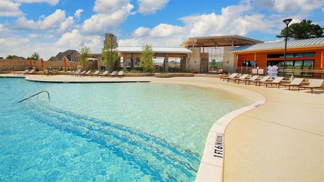 view of swimming pool featuring a patio