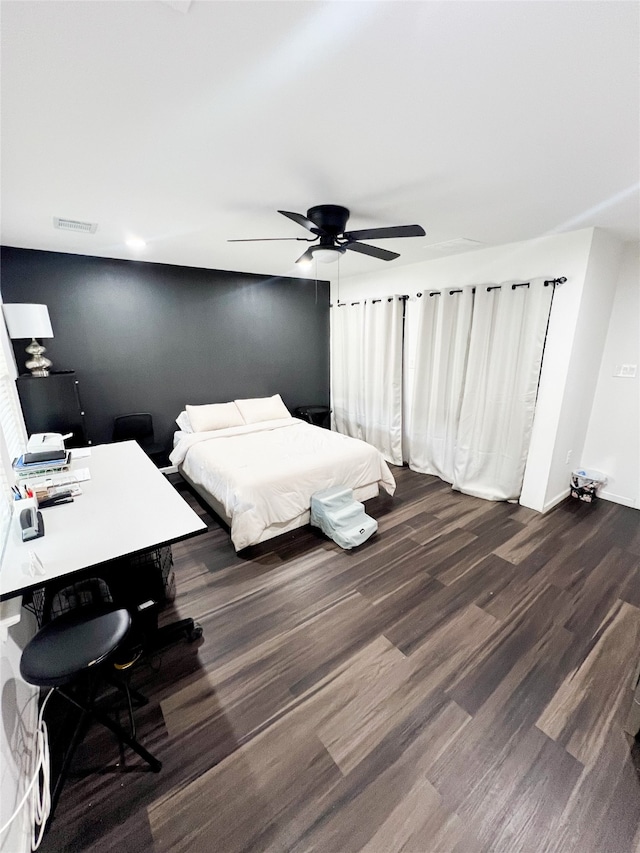 bedroom featuring dark hardwood / wood-style floors and ceiling fan