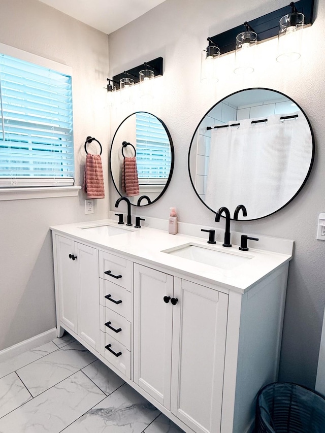 bathroom with vanity and curtained shower