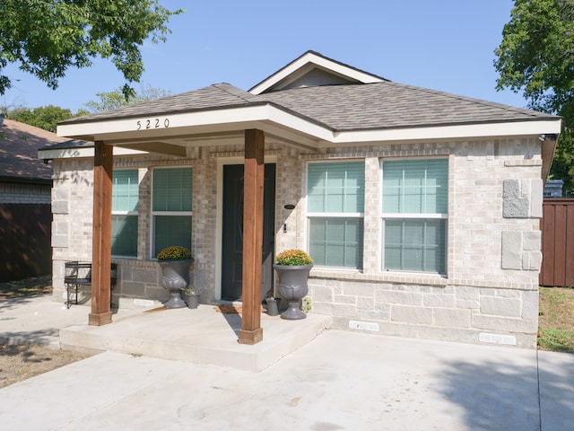 entrance to property with a patio