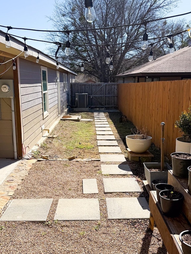 view of yard with central AC