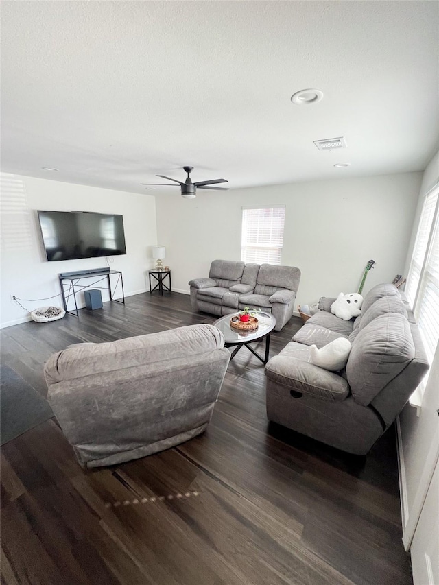 living room with hardwood / wood-style floors and ceiling fan