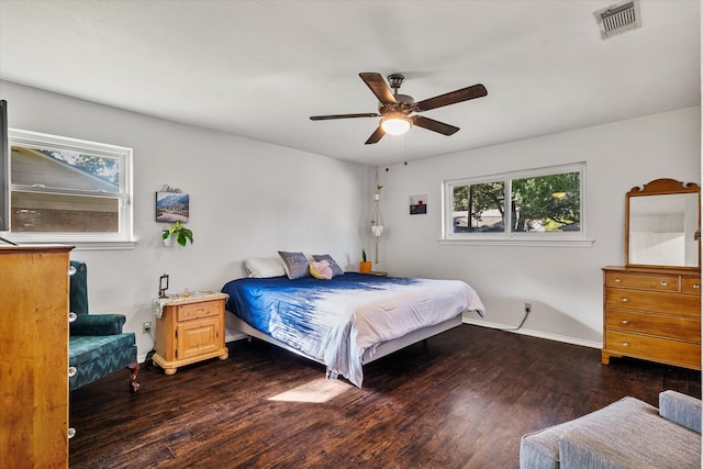 bedroom with ceiling fan and dark wood-type flooring