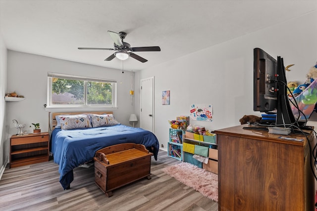 bedroom featuring light wood-type flooring and ceiling fan