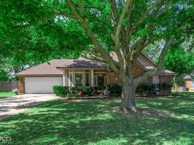 view of front of home with a garage and a front yard